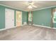 Large bedroom featuring neutral walls, carpet, and ensuite bathroom with soaking tub at 4204 Thetford Rd, Durham, NC 27707