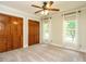 Bedroom with neutral walls, carpet, 2 large closets, and plenty of natural light from the 2 windows at 4204 Thetford Rd, Durham, NC 27707