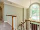 Bright foyer with beautiful chandelier, large window, and access to the staircase at 4204 Thetford Rd, Durham, NC 27707