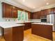 Modern kitchen featuring stainless appliances, countertops, and wood cabinets at 4204 Thetford Rd, Durham, NC 27707