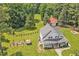 Expansive property featuring a well-maintained home, fenced yard, and mature trees at 4702 Pleasant Green Rd, Durham, NC 27705