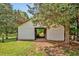 White barn on property with open center and fenced pasture at 4702 Pleasant Green Rd, Durham, NC 27705