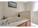 Relaxing bathroom featuring a jacuzzi tub with elegant marble countertops at 4702 Pleasant Green Rd, Durham, NC 27705