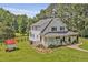Charming two-story home featuring a welcoming front porch and lush green lawn at 4702 Pleasant Green Rd, Durham, NC 27705