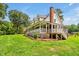 Charming two-story home with wrap-around porch, American flag, and well-manicured lawn at 4702 Pleasant Green Rd, Durham, NC 27705