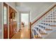 Inviting foyer featuring hardwood floors and a staircase, providing a warm welcome at 4702 Pleasant Green Rd, Durham, NC 27705