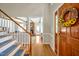 Welcoming foyer with hardwood floors and staircase, leading to a bright and airy living space at 4702 Pleasant Green Rd, Durham, NC 27705