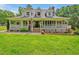 Inviting home featuring a full, covered front porch, perfect for relaxing at 4702 Pleasant Green Rd, Durham, NC 27705