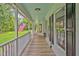 Charming porch with blue ceiling, white railing, and American flag adding a patriotic touch at 4702 Pleasant Green Rd, Durham, NC 27705