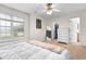 Bright bedroom featuring neutral walls, carpeted floors, and a serene atmosphere at 50 Rainwood Ct, Louisburg, NC 27549