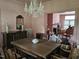 Dining room featuring a chandelier, dining set, and doorway into an adjacent sitting room at 500 W Main St, Benson, NC 27504