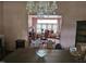 Dining room with a chandelier and doorway that opens into a second living space at 500 W Main St, Benson, NC 27504