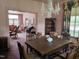 Dining room with a chandelier, doorway into the living space, and floral draperies at 500 W Main St, Benson, NC 27504