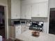 Kitchen with ample cabinet space, countertop appliances, and an open layout to the next room at 500 W Main St, Benson, NC 27504