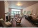 Spacious living room with period details including fireplace, hardwood floors, and traditional furnishings at 500 W Main St, Benson, NC 27504