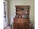 Charming interior featuring a hutch with decorative items, classic wood floors and an adjacent room at 500 W Main St, Benson, NC 27504