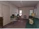 Spacious living room with vintage furniture and natural light at 500 W Main St, Benson, NC 27504