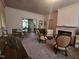 A pink living room featuring a fireplace, chandelier and period furniture at 500 W Main St, Benson, NC 27504