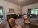 Open living room showcasing a piano, period furniture, and natural light at 500 W Main St, Benson, NC 27504