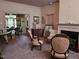 Spacious living room with fireplace, elegant seating, and doorway views into the dining room at 500 W Main St, Benson, NC 27504