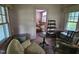 Sun room showcasing period furnishings and large windows for ample light at 500 W Main St, Benson, NC 27504
