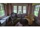 Sun room showcasing period furnishings and large windows for ample light at 500 W Main St, Benson, NC 27504