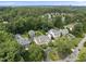 Aerial view showing lush landscaping, large homes and a view of the city skyline in the distance at 504 Yarmouth Rd, Raleigh, NC 27608