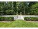 Beautifully landscaped backyard with stone steps, lush greenery, and manicured shrubs at 504 Yarmouth Rd, Raleigh, NC 27608