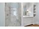Modern bathroom featuring a glass enclosed shower, marble sink, vanity, and chrome hardware at 504 Yarmouth Rd, Raleigh, NC 27608