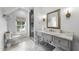 Elegant bathroom boasts a marble countertop, stylish mirror, and convenient walk-in shower at 504 Yarmouth Rd, Raleigh, NC 27608