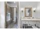 Elegant bathroom with a glass shower and a marble countertop, and stylish accents and fixtures at 504 Yarmouth Rd, Raleigh, NC 27608