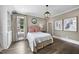 Comfortable bedroom with hardwood floors and built-in shelving offering both style and functionality at 504 Yarmouth Rd, Raleigh, NC 27608