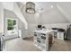 Bright bonus room with vaulted ceilings, large table and creative work space at 504 Yarmouth Rd, Raleigh, NC 27608