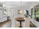 Breakfast nook features a round wood table, linen chairs, and access to an adjacent kitchen space at 504 Yarmouth Rd, Raleigh, NC 27608