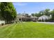 Well-manicured lawn leading to a beautiful house featuring a long drive and manicured landscaping at 504 Yarmouth Rd, Raleigh, NC 27608