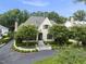 Lovely two-story home with manicured landscaping, a circular drive, and mature trees at 504 Yarmouth Rd, Raleigh, NC 27608