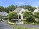 Lovely two-story home with manicured landscaping, a circular drive, and mature trees at 504 Yarmouth Rd, Raleigh, NC 27608