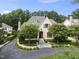 Lovely two-story home with manicured landscaping, a circular drive, and mature trees at 504 Yarmouth Rd, Raleigh, NC 27608
