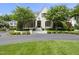 Charming two-story home with landscaped yard, circular drive, and blooming trees at 504 Yarmouth Rd, Raleigh, NC 27608