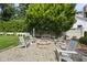 Outdoor fire pit area with stone fire pit and Adirondack chairs at 504 Yarmouth Rd, Raleigh, NC 27608