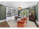 Inviting home office with custom built-ins, hardwood floors, and large windows with backyard views at 504 Yarmouth Rd, Raleigh, NC 27608