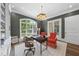 Comfortable home office featuring built-in shelving, a large window, and ample seating at 504 Yarmouth Rd, Raleigh, NC 27608