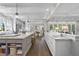 Spacious kitchen with a large marble island, coffered ceilings and hardwood floors at 504 Yarmouth Rd, Raleigh, NC 27608