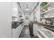 Well-organized laundry room with sleek countertops, white cabinets, and modern washer/dryer at 504 Yarmouth Rd, Raleigh, NC 27608