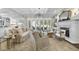 Bright and airy living room features a fireplace, coffered ceilings, french doors, and neutral decor at 504 Yarmouth Rd, Raleigh, NC 27608