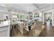 Elegant living room with a coffered ceiling, a cozy fireplace and views of the outdoor space at 504 Yarmouth Rd, Raleigh, NC 27608