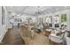 Spacious living room with hardwood floors, coffered ceilings, and French doors leading to the outside at 504 Yarmouth Rd, Raleigh, NC 27608