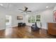 Inviting living room with hardwood floors, ceiling fan, and a comfortable leather armchair at 504 Yarmouth Rd, Raleigh, NC 27608