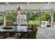 Picturesque outdoor dining area with a large table and a view of the landscaped backyard at 504 Yarmouth Rd, Raleigh, NC 27608