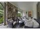 Inviting outdoor patio with a stone fireplace and cozy seating arrangement at 504 Yarmouth Rd, Raleigh, NC 27608